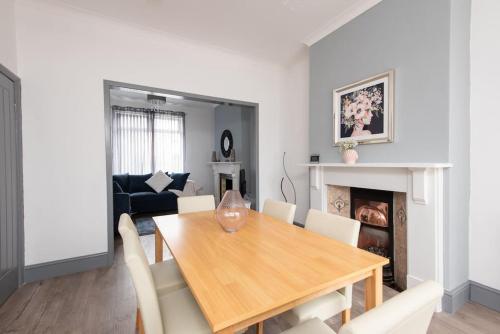 a dining room with a wooden table and chairs at 26 Station in Ushaw Moor