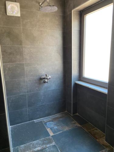 a bathroom with a shower with a sink at On Oda Oludeniz in Oludeniz