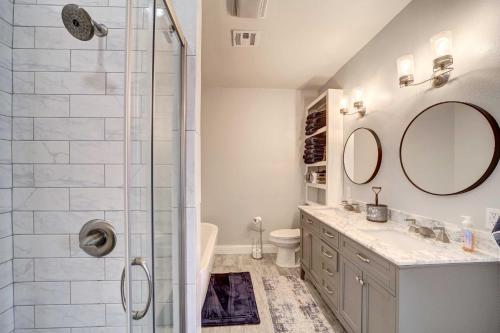 a bathroom with a shower and a sink and a mirror at Pet-Friendly Afton Vacation Rental with Game Room in Afton