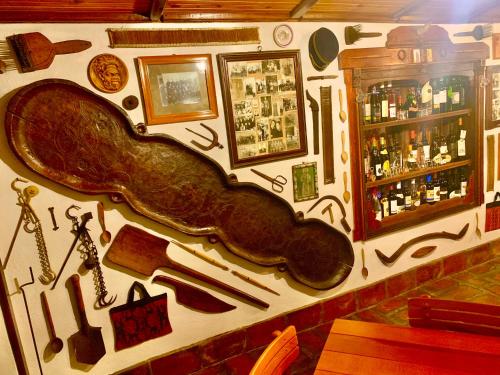 a wall in a bar with a gun painted on it at Etno selo Stanojevic in Boljevac