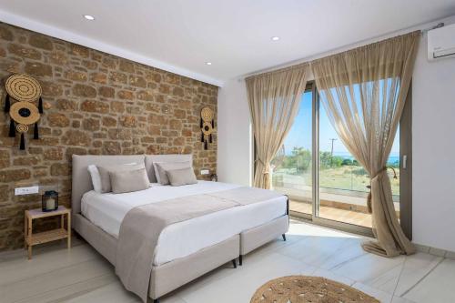 Ένα ή περισσότερα κρεβάτια σε δωμάτιο στο Villa Elios Residence