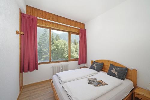 Postel nebo postele na pokoji v ubytování iFlat Apartment Madonna di Campiglio Adamello 1