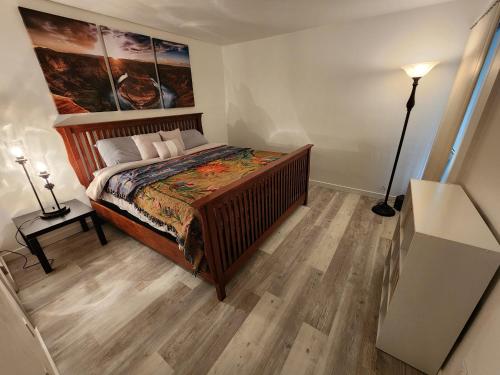 a bedroom with a bed with a painting on the wall at Lux Resort Condo (Old Town Scottsdale!) in Scottsdale