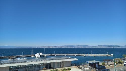 a marina with a plane parked on a dock at The Originals Boutique, Hôtel Alizé, Évian-les-Bains in Évian-les-Bains