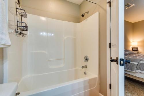 a bathroom with a shower and a bath tub at Bryant Vacation Rental about 16 Mi to Little Rock in Bryant