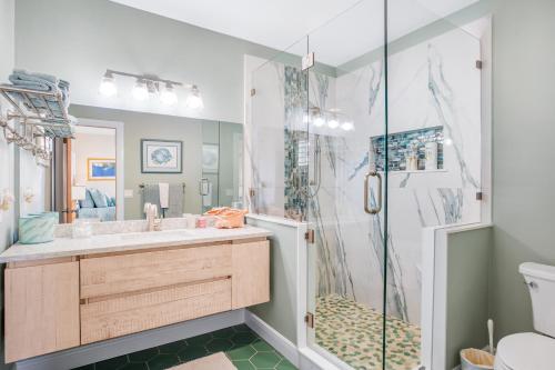 a bathroom with a shower and a sink at The Nautical Nimbus in Big Pine Key