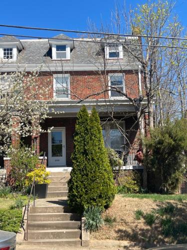 a brick house with a staircase in front of it at Deluxe King Master Suite in Washington, D.C.