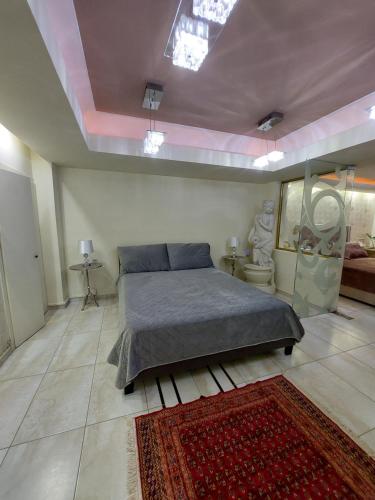 a large bedroom with a bed and a rug at Aphrodite View in Korakiaí