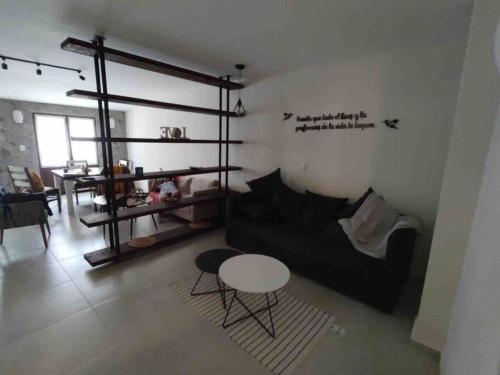 Ruang duduk di Hermoso departamento en Val’Quirico Loft Frontana