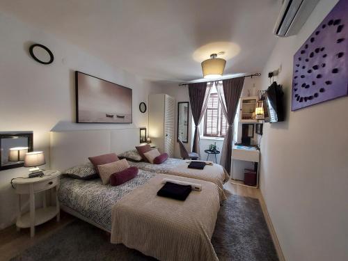 Posteľ alebo postele v izbe v ubytovaní Apartment Agora