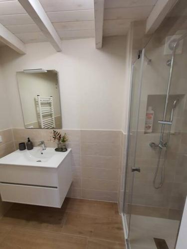 a bathroom with a sink and a shower at Casa con encanto en Laxe in Laxe
