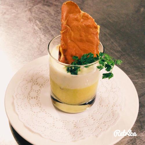a dessert with a piece of bread in a glass on a plate at Hotel Brunnenhof in Neustift im Stubaital