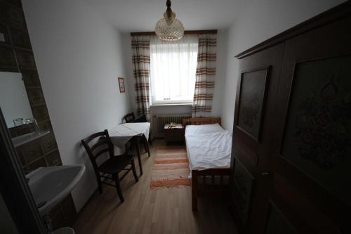 Postel nebo postele na pokoji v ubytování Hotel Kleinmünchen