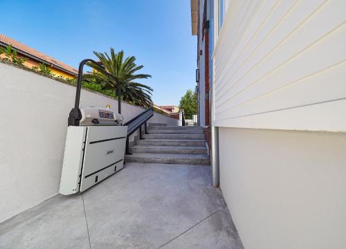 a building with a staircase with a dresser next to it at Apartamentos Salinas 18 in Salinas