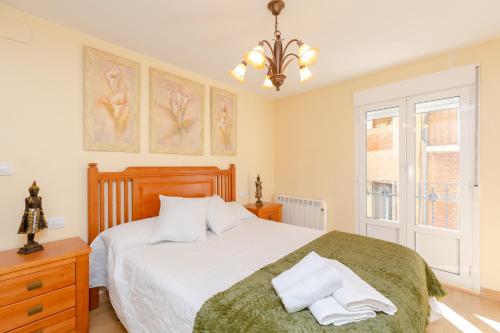a bedroom with a large bed and a window at Serendipity by Fidalsa in Teruel