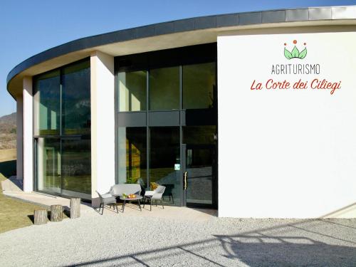 an office building with a sign that reads an cubic act office at Agritur La Corte dei Ciliegi in Trento