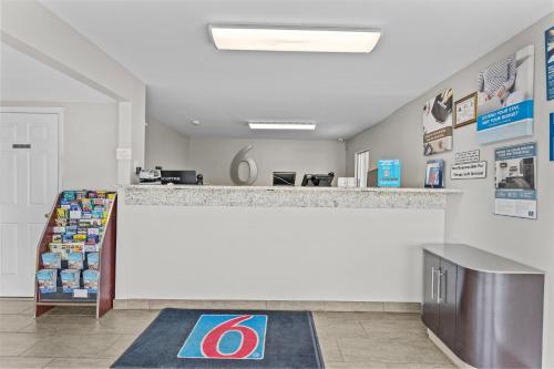 a store lobby with a counter and a counter top at Studio 6 Wilmington, NC in Wilmington