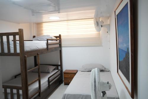 Dviaukštė lova arba lovos apgyvendinimo įstaigoje Providencia Travel Apartamento