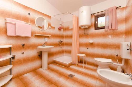 Kúpeľňa v ubytovaní Apartments Spavalo