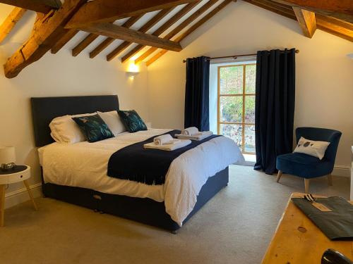 a bedroom with a large bed and a window at Ty Bont in Wrexham