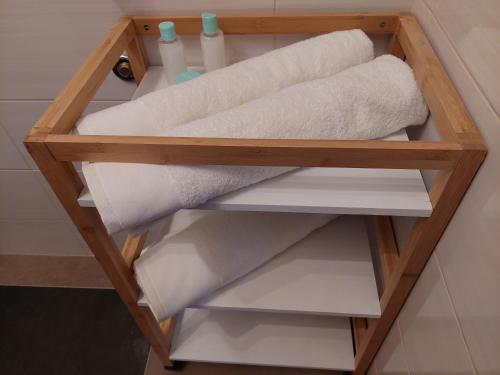 a roll of toilet paper on a shelf in a bathroom at Apartament Happy Stay in Rzeszów