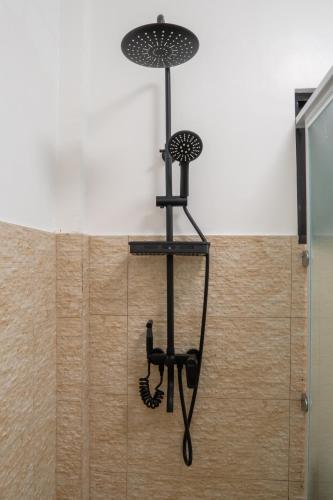 a chandelier hanging from a wall in a bathroom at The Mayana Resort in Dauis