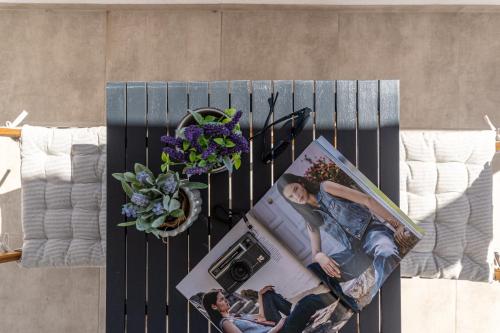 an overhead view of a table with a picture of two people at Casa Aelia ,Stelida Naxos in Stelida