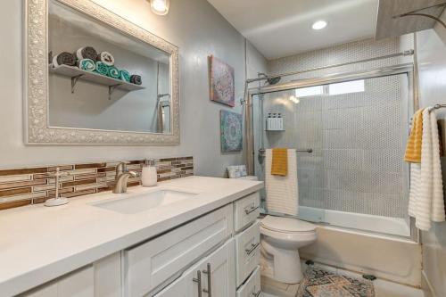 a bathroom with a sink and a toilet and a shower at Captivating 3 Bedroom Home W Hot Tub in Citrus Heights