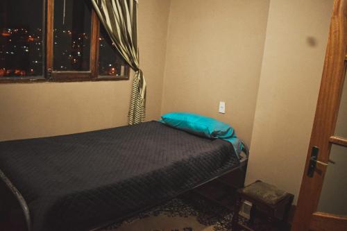 Ένα ή περισσότερα κρεβάτια σε δωμάτιο στο Santa Pacha