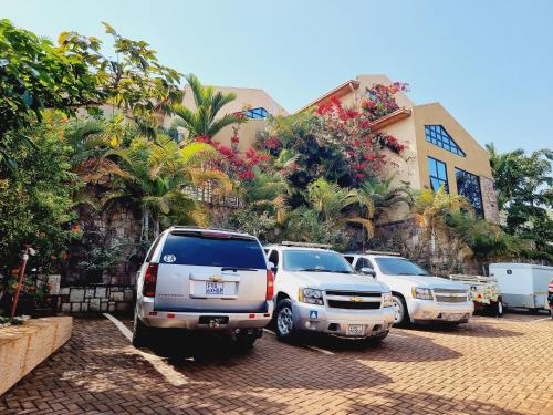 a group of cars parked in a parking lot at High Ground Villa Ltd in Kigali