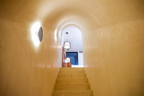 a hallway with stairs in a building at Eterna Tulum in Tulum