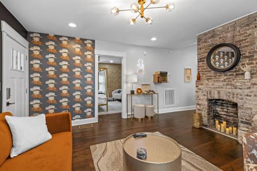 a living room with a couch and a fireplace at Space Cowboy - Huge yard, Firepit, close2downtown in Nashville