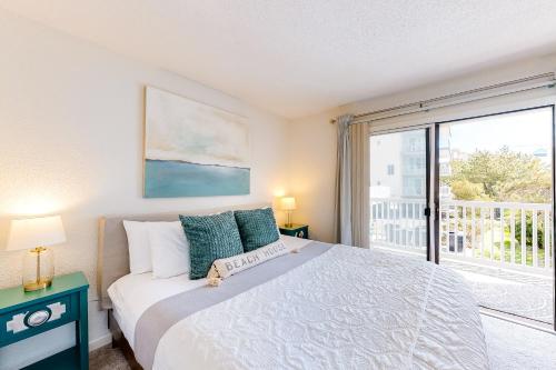 a bedroom with a bed and a large window at Sea Mark 208 in Ocean City