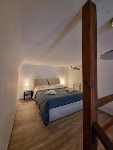 a bedroom with a large bed in a room at Casa vacanze Piazza San Pietro in Bari