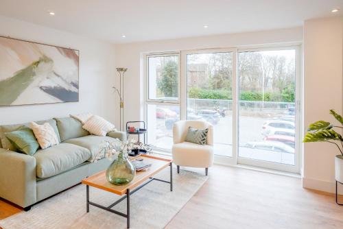 a living room with a couch and a table at 39 Teesra House in Plymouth