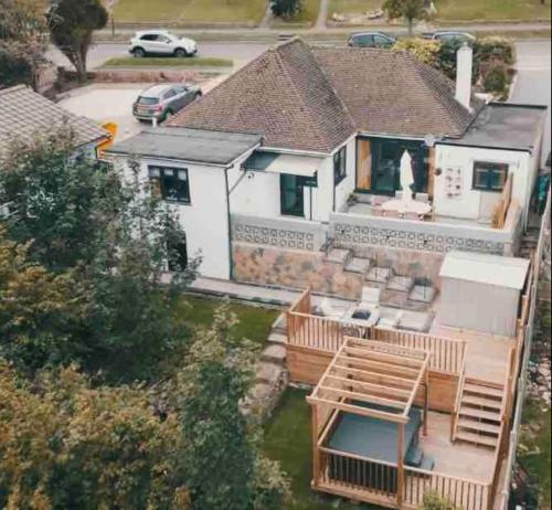 an aerial view of a house with a yard at Luxury Renovated Bungalow with wheel chair access, Hot Tub and Fire Pit in Wouldham