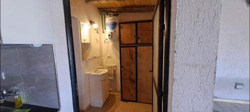 a bathroom with a sink and a toilet in a room at Sol montañes in La Carrodilla