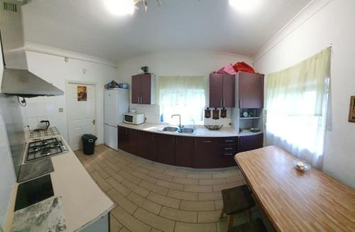 a kitchen with a sink and a counter top at Хотел на Печерской in Kyiv