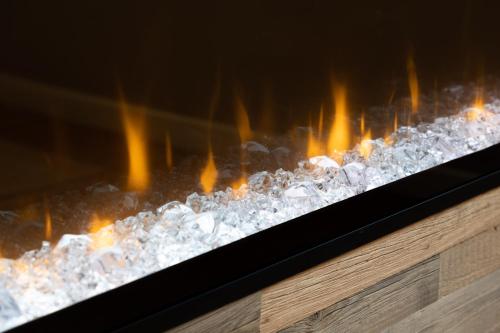 a close up of a stove with fire at High Street Town House in Manchester