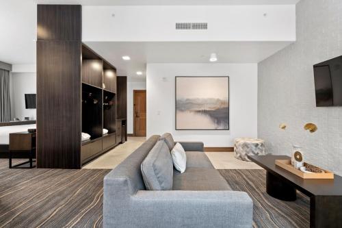 a living room with a couch and a tv at Flying Horse Resort & Club in Colorado Springs