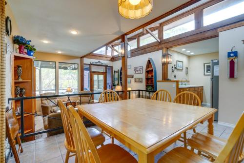a dining room with a wooden table and chairs at Deck and Gas Grill Riverfront McQueeney Duplex in McQueeney