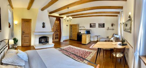a living room with a bed and a table at Apartmány Lavander Mikulov in Mikulov