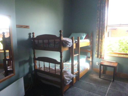 a room with two bunk beds and a window at Southern Comfort in Invercargill