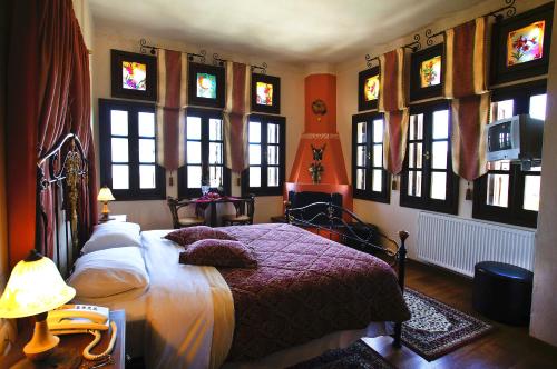 Postel nebo postele na pokoji v ubytování Hotel Dryalos