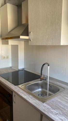 a kitchen with a sink and a counter top at AMORE MÍO Hellín in Hellín