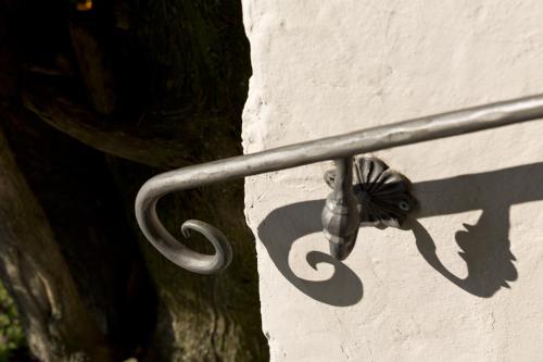 a metal object on the side of a building at Schloss Plars wine & suites in Lagundo