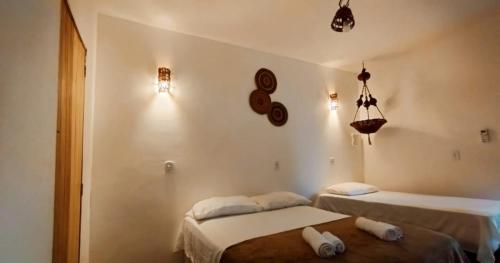 a room with two beds in a room at Al Mare_ BG in Barra Grande
