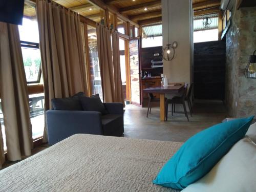 a bedroom with a bed and a living room at La Comarca Loft in San Javier