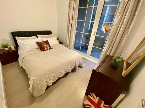 a small bedroom with a bed and a window at Sanctuary Spaces at The Shard with private parking in London