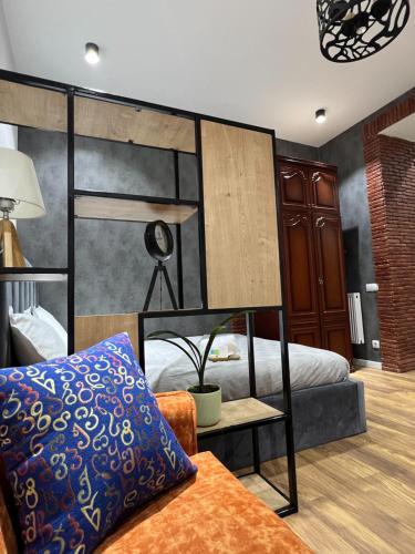 a bedroom with a bunk bed and a couch at Room 42 in Tbilisi City